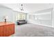 Bonus room featuring carpet, a light fixture, and a window, with plenty of space at 12002 Cobham Ct, Huntersville, NC 28078