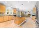 Spacious kitchen with stainless steel appliances, granite counters, and a large kitchen island at 12002 Cobham Ct, Huntersville, NC 28078