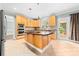 Kitchen features a central island, modern appliances, and convenient access to the outdoor deck at 12002 Cobham Ct, Huntersville, NC 28078