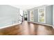 Spacious living room featuring hardwood floors, bright windows, and an open layout at 12002 Cobham Ct, Huntersville, NC 28078
