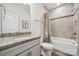 Well-appointed bathroom featuring a combination tub and shower with modern fixtures at 12410 Franklin Park Ln, Huntersville, NC 28078