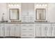 Elegant bathroom featuring double sinks with granite countertops and ample cabinet storage at 12410 Franklin Park Ln, Huntersville, NC 28078