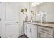Well-lit bathroom featuring modern vanity with granite countertops and decorative wall art at 12410 Franklin Park Ln, Huntersville, NC 28078