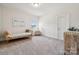 Bright bedroom with light walls, a cozy daybed, and unique decorative elements at 12410 Franklin Park Ln, Huntersville, NC 28078
