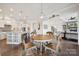 Inviting breakfast nook connects kitchen, living room, and staircase at 12410 Franklin Park Ln, Huntersville, NC 28078
