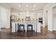 Modern kitchen featuring a large island with seating, stainless steel appliances, and ample cabinet space at 12410 Franklin Park Ln, Huntersville, NC 28078