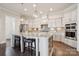 Bright kitchen featuring granite countertops, stainless steel appliances, and pendant lighting at 12410 Franklin Park Ln, Huntersville, NC 28078