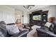 Cozy living room with a media center and plush seating, perfect for relaxing at 12410 Franklin Park Ln, Huntersville, NC 28078