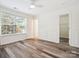 Bedroom with hardwood floors, fresh paint, closet, and a large window offering natural light at 146 Rapids Rd, Fort Mill, SC 29715