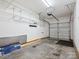 A well-lit garage with shelving and an automatic door opener provides secure parking and storage at 146 Rapids Rd, Fort Mill, SC 29715