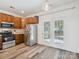 Bright kitchen with stainless steel appliances and french door access to back at 146 Rapids Rd, Fort Mill, SC 29715