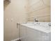 Functional laundry room equipped with washer, dryer, and convenient shelving for storage at 146 Rapids Rd, Fort Mill, SC 29715