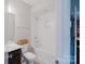 Clean bathroom featuring a dark vanity and a shower-tub combination at 15103 Cimarron Hills Ln, Charlotte, NC 28278
