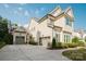 Elegant home features a large driveway, three-car garage, and well-maintained landscaping at 15103 Cimarron Hills Ln, Charlotte, NC 28278