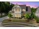 Charming two-story home boasts a well-manicured lawn and inviting curb appeal with neutral colors and a warm, welcoming ambiance at 15103 Cimarron Hills Ln, Charlotte, NC 28278