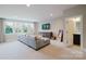 Spacious living room with large windows and a comfortable gray sectional sofa at 15103 Cimarron Hills Ln, Charlotte, NC 28278