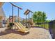 Community playground featuring slides, climbing structures, and a wood chip surface at 15103 Cimarron Hills Ln, Charlotte, NC 28278