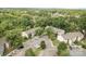 Aerial view of property showcasing nearby parking and mature trees surrounding the homes at 1602 Eagles Pl # J103, Rock Hill, SC 29732