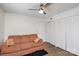 Cozy bedroom featuring wood floors, ceiling fan and a closet for ample storage at 1602 Eagles Pl # J103, Rock Hill, SC 29732