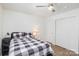 Bedroom features wood flooring, closet and a ceiling fan with lighting fixture at 1602 Eagles Pl # J103, Rock Hill, SC 29732