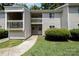 Inviting condo with well-maintained landscaping, and walkway leading to the entry at 1602 Eagles Pl # J103, Rock Hill, SC 29732