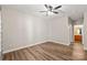 The bright, empty bedroom features wood-look flooring and neutral walls at 16344 Redstone Mountain Ln, Charlotte, NC 28277