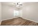 Bright bedroom with sleek floors, a ceiling fan, and a double-door closet at 16344 Redstone Mountain Ln, Charlotte, NC 28277