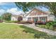 Clubhouse entrance features manicured landscaping and ample parking at 16344 Redstone Mountain Ln, Charlotte, NC 28277