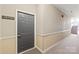 Condo hallway featuring unit number, carpeting, and staircase access at 16344 Redstone Mountain Ln, Charlotte, NC 28277