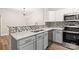 Well-appointed kitchen with white quartz countertops, stainless steel appliances, and mosaic backsplash at 16344 Redstone Mountain Ln, Charlotte, NC 28277