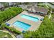 Aerial view of the two community swimming pools surrounded by lush landscaping at 16344 Redstone Mountain Ln, Charlotte, NC 28277