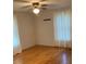 Cozy bedroom features warm hardwood floors, ceiling fan, and soft natural light at 1721 9Th Ne Ave, Hickory, NC 28601