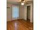 Bedroom features wood floors, a closet, and natural light from the window at 1721 9Th Ne Ave, Hickory, NC 28601