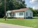 Charming single-story home with white siding and a well-maintained front yard and a brown roof at 1721 9Th Ne Ave, Hickory, NC 28601