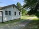Charming home exterior showcasing fresh grass, driveway, and mature shade trees at 1721 9Th Ne Ave, Hickory, NC 28601