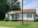 A well-maintained single-story home featuring classic architecture and a lovely green lawn at 1721 9Th Ne Ave, Hickory, NC 28601