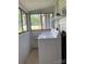 Functional laundry room featuring a washer, a dryer, and natural lighting from large windows at 1721 9Th Ne Ave, Hickory, NC 28601
