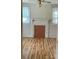 Living room with hardwood floors, fireplace, and natural light from large windows at 1721 9Th Ne Ave, Hickory, NC 28601