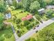 Expansive aerial view of a well-maintained property with lush greenery and a private pool at 19924 Floral Ln, Cornelius, NC 28031