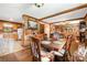 Dining room with wood paneled walls, hardwood floors and view into kitchen at 19924 Floral Ln, Cornelius, NC 28031