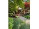 Inviting front porch with rocking chairs and lush landscaping at 19924 Floral Ln, Cornelius, NC 28031