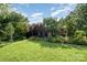Charming home with manicured lawn and beautiful flowerbeds at 19924 Floral Ln, Cornelius, NC 28031