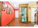 Hallway with hardwood floors, colorful walls, and staircase at 19924 Floral Ln, Cornelius, NC 28031