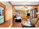 Cozy living room with wood paneling and hardwood floors at 19924 Floral Ln, Cornelius, NC 28031
