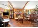 Cozy living room with brick fireplace, hardwood floors, and wood paneling at 19924 Floral Ln, Cornelius, NC 28031