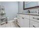 Cozy bathroom featuring white cabinetry, granite countertops, and modern fixtures at 2043 Shadwell Ct, Gastonia, NC 28056