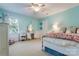 Bedroom with teal walls, carpet, desk, and a large window for natural light at 2043 Shadwell Ct, Gastonia, NC 28056