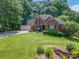Beautiful brick two-story home with a well-manicured lawn and attached two car garage at 2043 Shadwell Ct, Gastonia, NC 28056