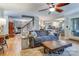 Spacious living room showcasing hardwood floors, comfortable seating, and seamless flow into other rooms at 2043 Shadwell Ct, Gastonia, NC 28056