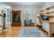 Well-lit office space with hardwood floors, built-in shelving, and a comfortable workspace at 2043 Shadwell Ct, Gastonia, NC 28056